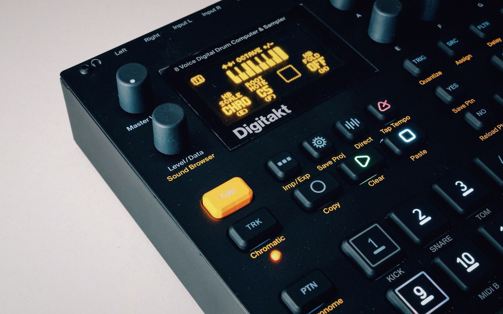 A drum machine step-button row in close macro, buttons worn