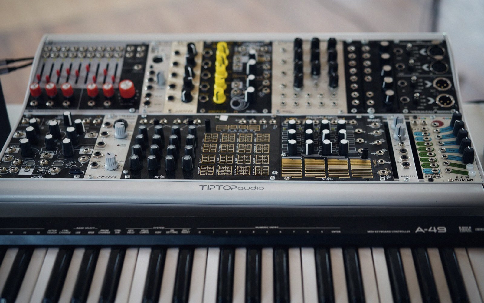 A modular synthesiser patchbay with cables in a dense tangle